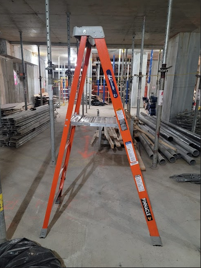 A stepladder in the middle of a construction site